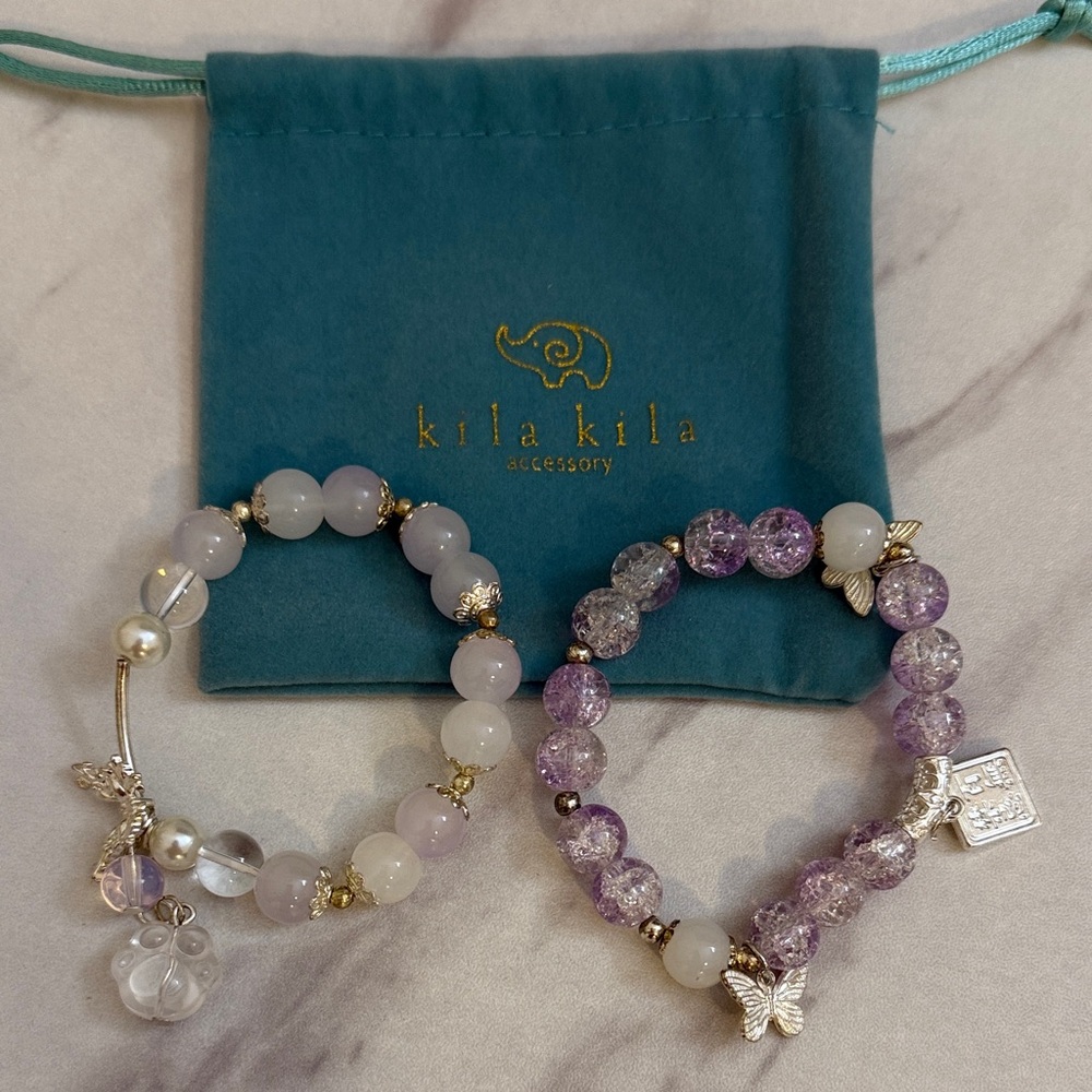 Purple and White Beaded Bracelets with Charms